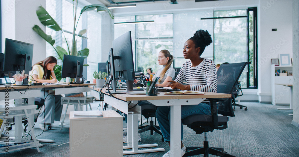 Modern professional office environment with diverse team collaborating around advanced multifunction printers and office technology showcasing comprehensive brand support services